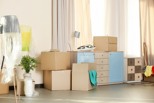 Professional packers organising household items room by room in Lambeth