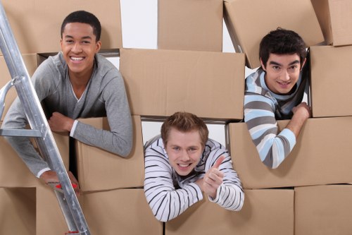 Packed moving boxes and furniture ready for transport in Lambeth