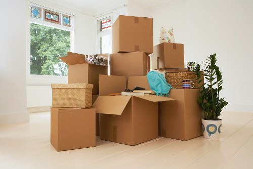 Professional movers loading a van on a local Lambeth street
