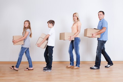 Careful unloading and room placement during a Lambeth moving service